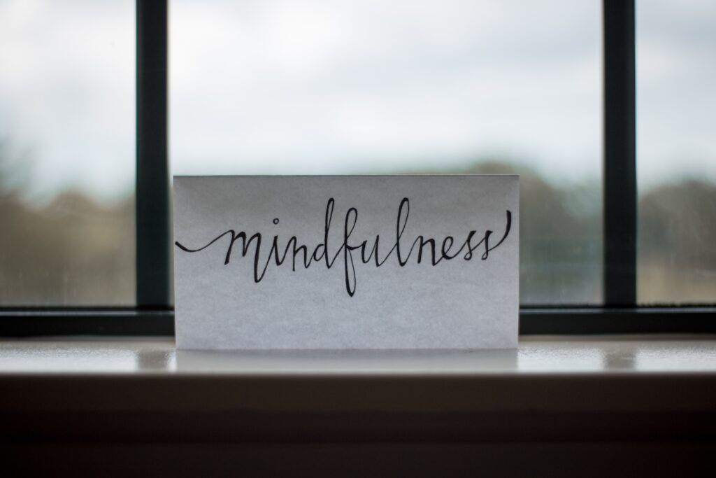 Mindfulness and meditation - can they help me? 1 A piece of paper with mindfulness wriiten on it sitting on a window sill